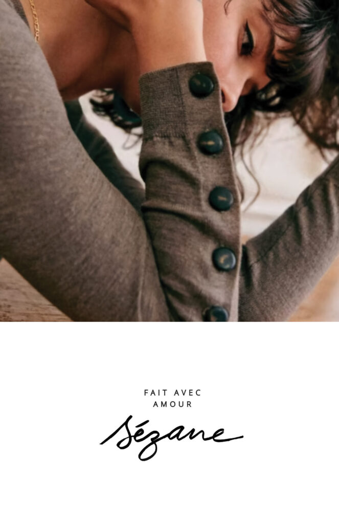 This image is the cover page of the Sezane catalog completed in Publication design class. It features a large image of a short-haired woman wearing a shirt from the new Sezane collection. Below the image is the brand name and tagline, centered across the bottom half of the page.